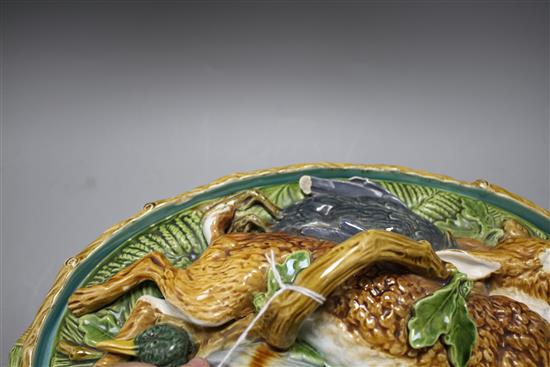 A Mintons majolica game tureen, with hare and poultry lid and oak leaf base, impressed marks, 36cm